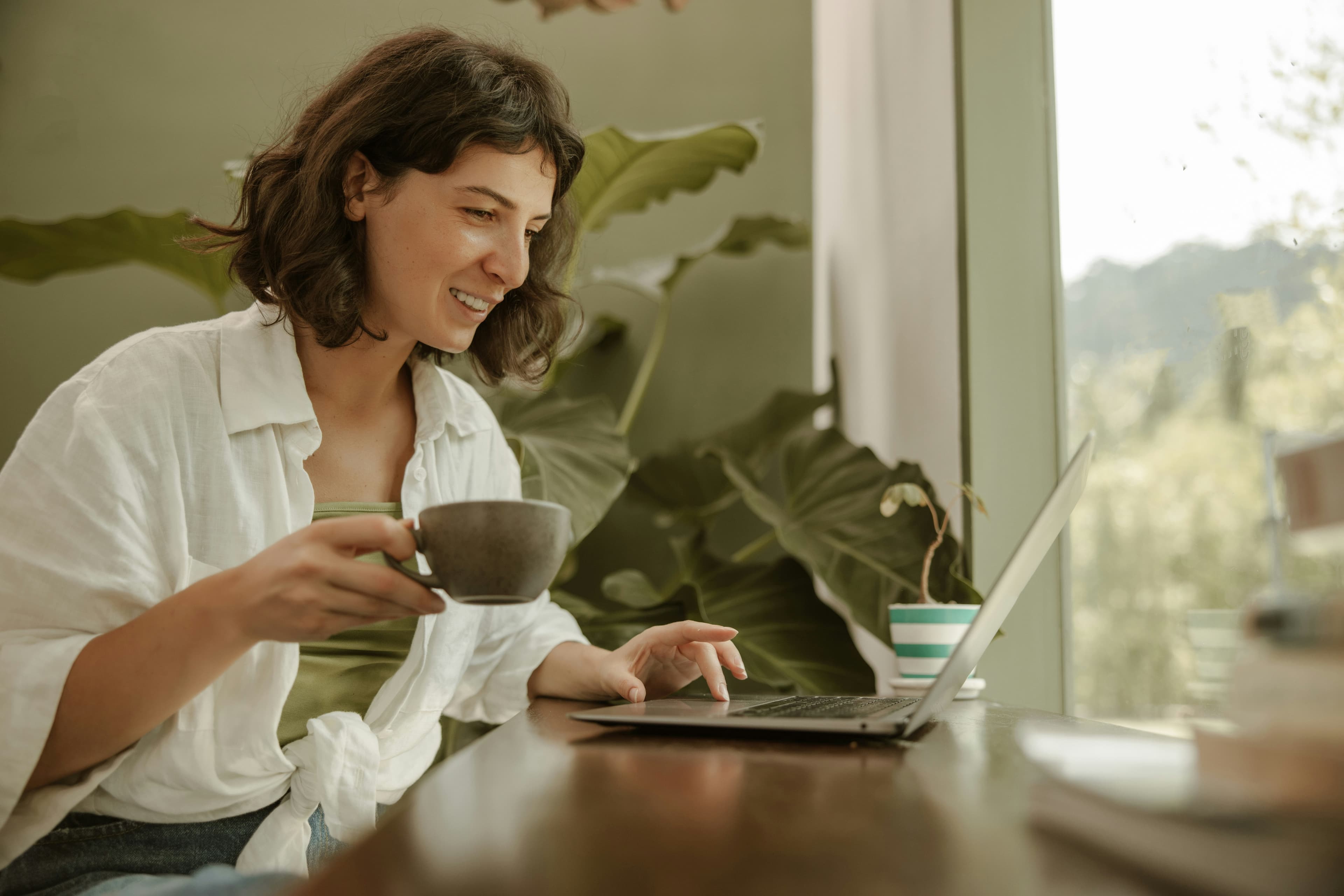 A team member reviewing project progress over coffee